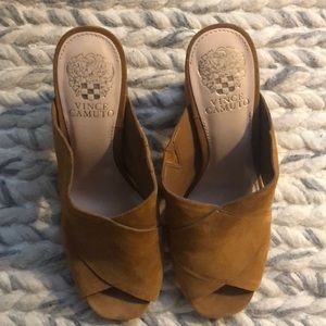 Heeled peep toe mules.